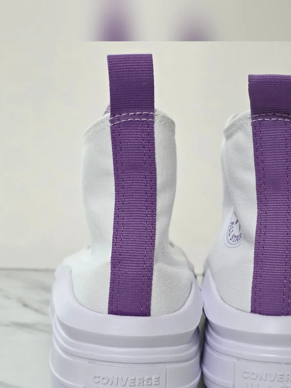 Converse White High Top Sneaker with Purple Star Accent
